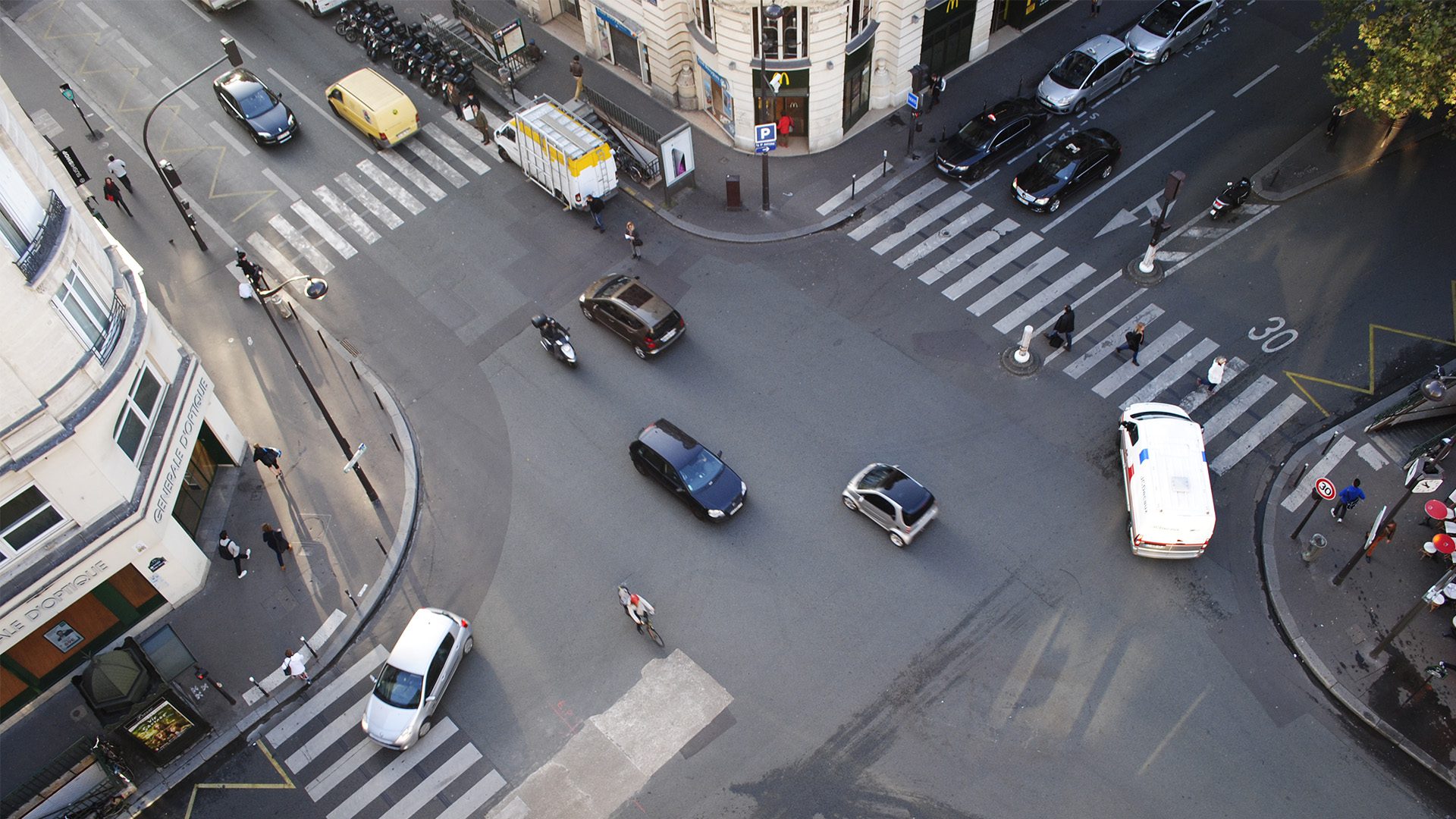 Overhead view of a city intersection with connected road users